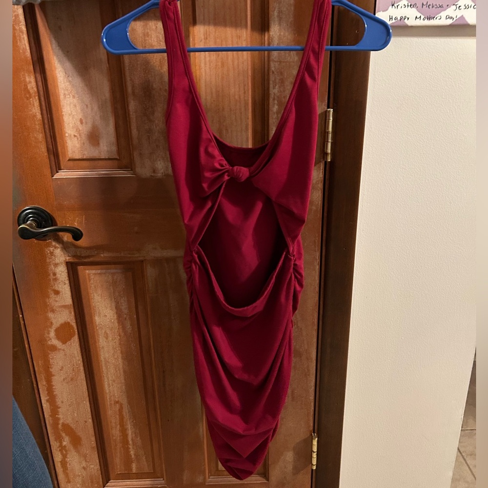 A simple body con dress with a cut out on the front
